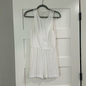 Alice and Olivia white lace open back romper, size 6
